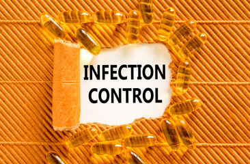 Infection control symbol. Concept words Infection control on beautiful white paper. Yellow pills...