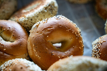 Close up of fresh sesame bagels stacked together.