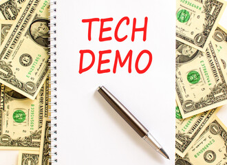 Tech demo symbol. Concept word Tech demo on beautiful white note. Dollar bills. Beautiful dollar...