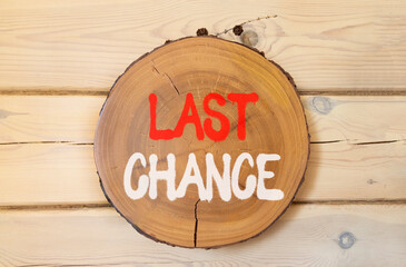 Last chance symbol. Concept word Last chance on beautiful wooden circle on wooden wall. Beautiful wooden wall background. Business last chance concept. Copy space.
