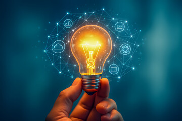 Hand holding light bulb with digital icons representing innovation and technology