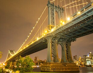 Night view of a suspension bridge with city skyline
