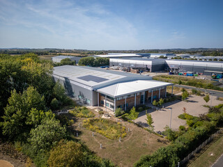 Large business park with warehouse units, industrial estate buildings, distribution centre,...