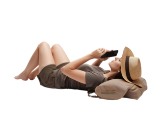 Serene woman lies on pillow, captivated by smartphone content on transparent space