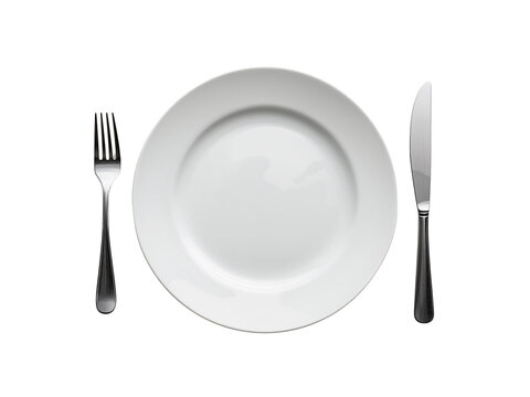 Elegant white dinner plate setting with fork and knife against an isolated simple transparent