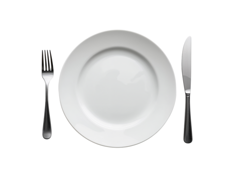 Elegant white dinner plate setting with fork and knife against an isolated simple transparent