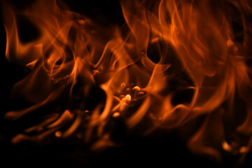 Flame fires. Burn lights on a black background. Fire flames on black background. Abstract fire...