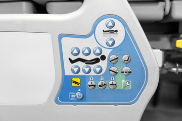 Modern hospital bed control panel with ergonomic buttons for patient position adjustment, safety...