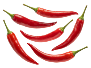 A vibrant arrangement of red chili peppers against a stark black background representing heat spice and culinary creativity for cooking themes