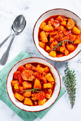 meat goulash with potatoes and carrots, sweet peppers, in a saucepan, top view, traditional Hungarian soup, homemade, no people,