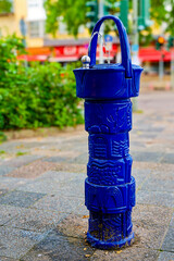 A public drinking water dispenser on a street in Berlin, Germany.