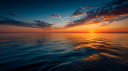 Obraz premium Serene Sunset Over Calm Ocean Waves Under Colorful Sky