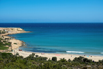 Sarakiniko Beach in Gavdos Island, Greece, featuring turquoise waters, golden sand, and clear blue sky