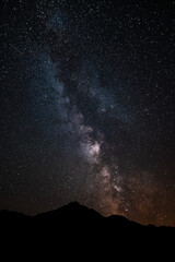 Starry night above the Pyrenees mountain in France