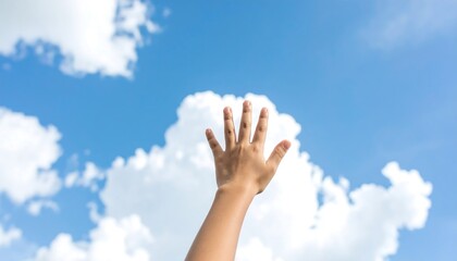 Hand reaching for the sky, fluffy clouds, bright blue sky