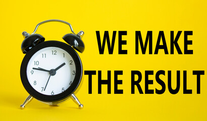 We make the result symbol. Beautiful yellow background with alarm clock with words We make the...