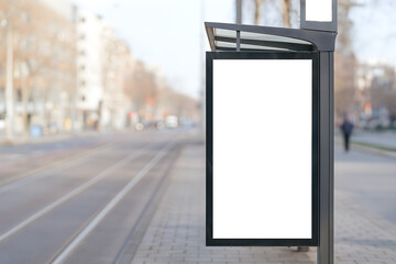 Blank billboard stands at a bus stop on a city street, ready for an advertisement.
