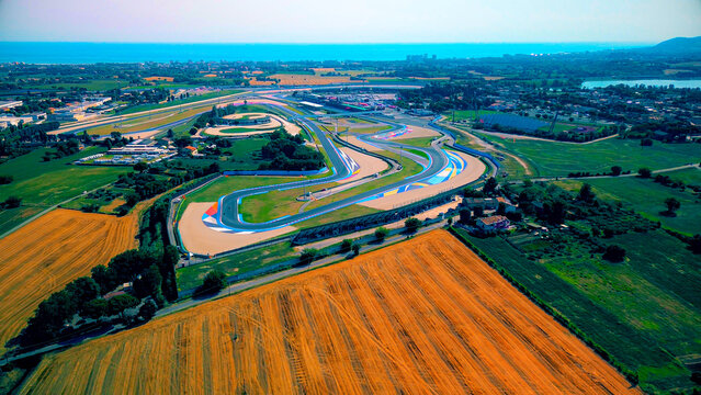 Driving school. Aerial view of the race track open for motorcycle training. Asphalt road. Drone footage. Group of motorcyclists on motorcycles. Motorsport. Italy, Misano, 21.07.2025