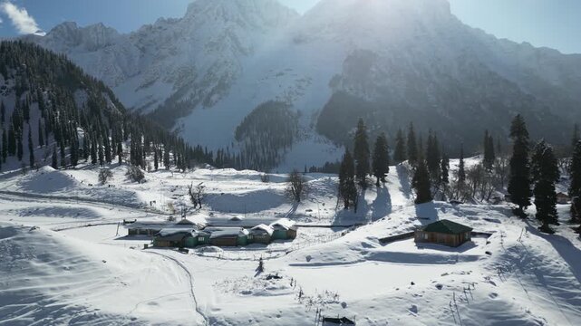 High-altitude aerial view over Sonmarg&rsquo;s snow-filled valleys, where meadows disappear into pristine Himalayan peaks.