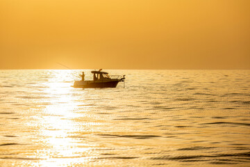 Fishing boat on the Adriatic Sea at sunset near the Istrian coast