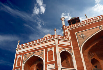 Architecture monument in India. Mughal sandstone building with arch facade, ornate historic heritage