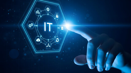 Hand touching glowing it interface with digital network connections