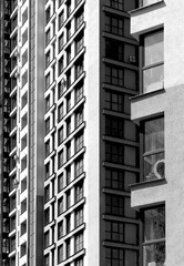 Building facade in downtown exterior view. Modern concrete multistorey architecture with window
