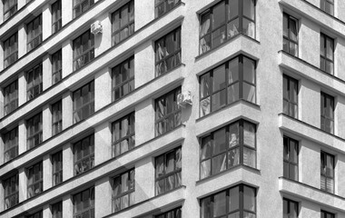 Building pattern in metropolitan city. Modern concrete multistorey architecture highlights tall