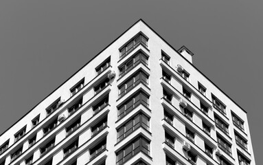 Building. Modern concrete multistorey architecture displays sleek window facade, downtown