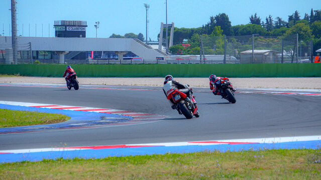 driving school. A racing track has been opened, where motorcycle riding trainings are held. Honda moto. A group of motorcyclists. Slow motion. Sun day. Moto sport Italy Misano 29.08.2025
