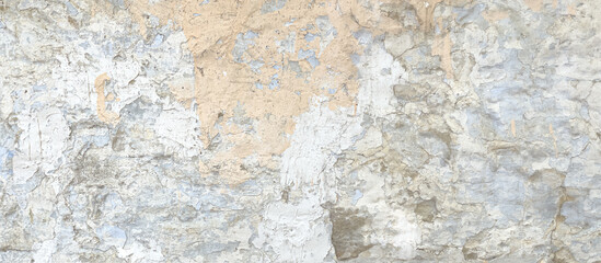 Weathered wall showing layers of cracking paint and plaster