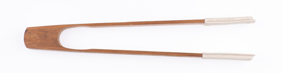 wooden clothes tongs isolated on white background