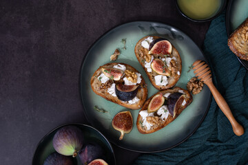 Horizontal Top View of Three Fig and Goat Cheese Toasts with Honey and Walnuts