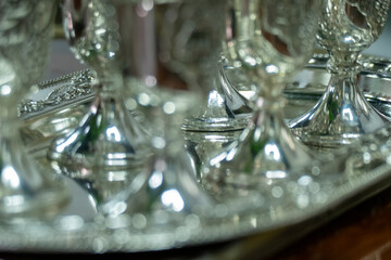 Silver shot glasses tray close up elegant metallic drinkware luxury hospitality premium service polished