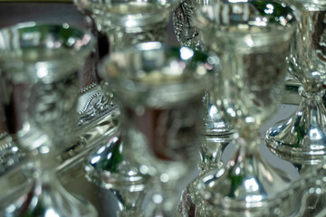 Silver shot glasses tray close up elegant metallic drinkware luxury hospitality premium service polished