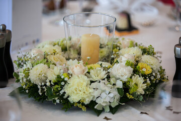 Elegantly decorated tables with colorful flowers at a wedding. Close-ups of glasses, flowers, and decorations. Symbolic of a wedding, soft background.