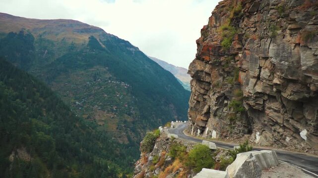 Dangerous road passing through Himalaya mountains in Kinnaur district, Himachal Pradesh, India. Extremely dangerous road. Road in the mountains. Travel, holidays and road-trip concept.
