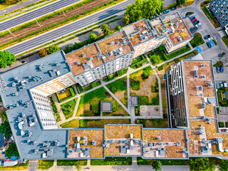 Drone photography of apartment complex rooftop during summer day