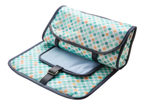 Portable baby changing mat with colorful polka dot pattern isolated on transparent background