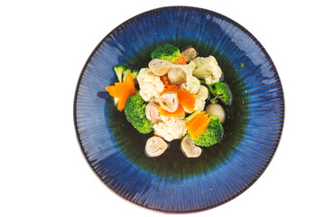 Stir-fried mixed vegetables with broccoli, cauliflower, carrots and straw mushrooms isolated on white background