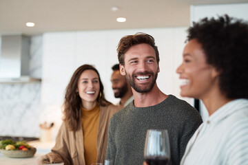 Happy diverse friends enjoying a wine party in a modern kitchen. The image represents joyful connection, celebration, and togetherness. Suitable for lifestyle, social, or relationship content.
