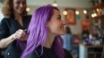 A skilled hairstylist meticulously styles a client's freshly colored purple hair. The scene focuses on the professional craft and the warm, trusting interaction between the stylist and her happy clien