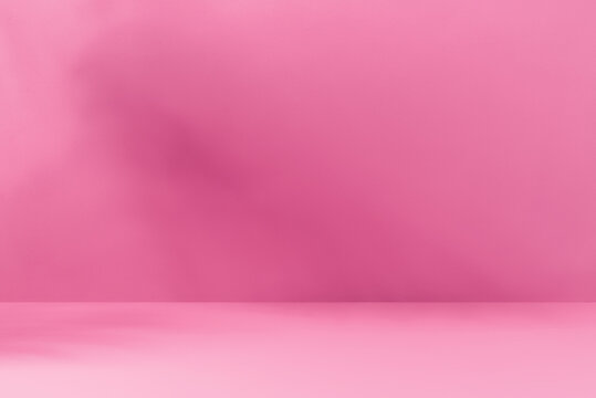 Minimalistic abstract pink background for product presentation with aesthetic light and shadows