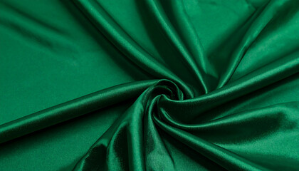 Luxurious Emerald Green Satin Fabric Swirling Drape; Elegant, Smooth Texture; Rich, Deep Color;  High-Resolution Textile Background.