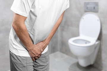 Person with urinary problems, Medical problem urinary incontinence. people with crotch pain, Man...