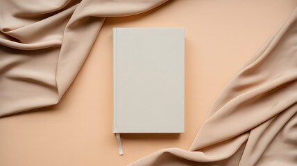 Fototapeta premium Minimal Book Mockup with Beige Fabric Background – Elegant Blank Hardcover for Branding, Cover Design, and Product Presentation