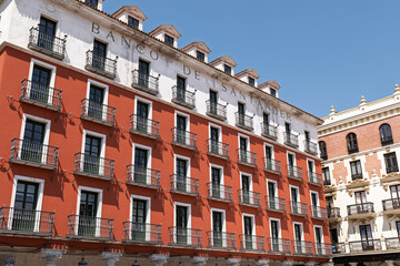 Naklejka premium Valladolid, Spain 2 August 2025 – Facade of the Banco de Santander building in the Plaza Mayor on a bright sunny day.