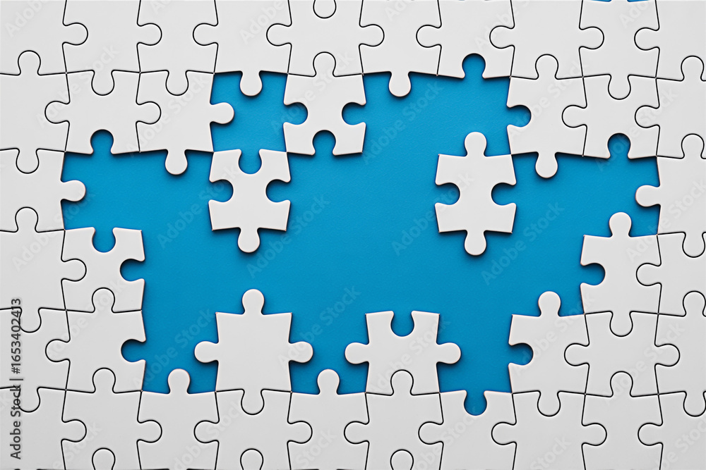 Poster white jigsaw puzzle pieces on a blue background representing problem solving and teamwork concept
