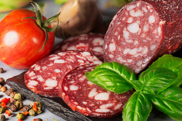 dry sausage sliced with spices and basil
