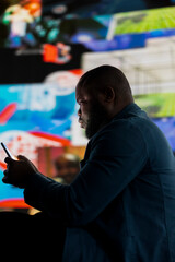 African American man suffering from mental health disorder due to toxic connection, illustrating...